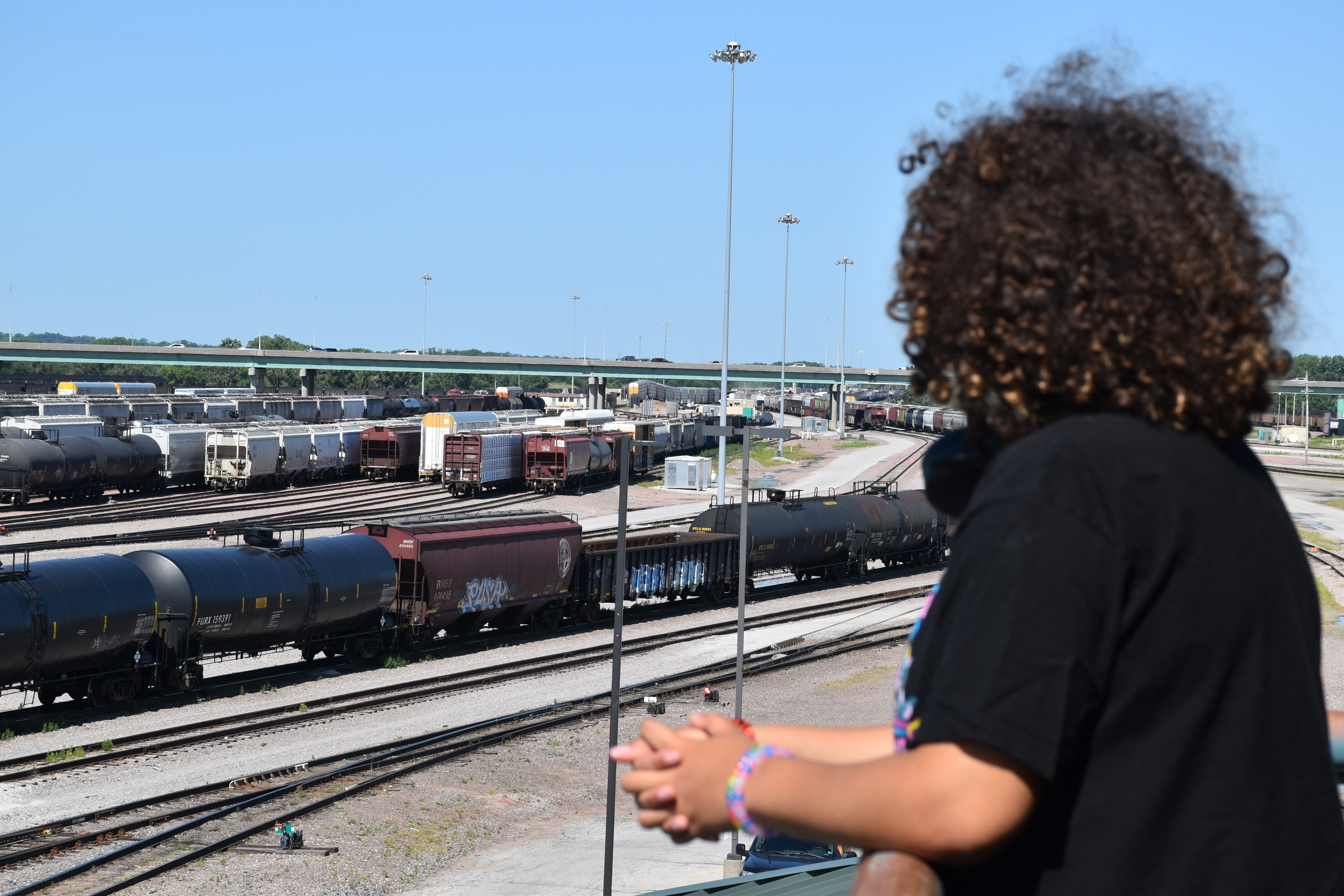 Student looking over railyard