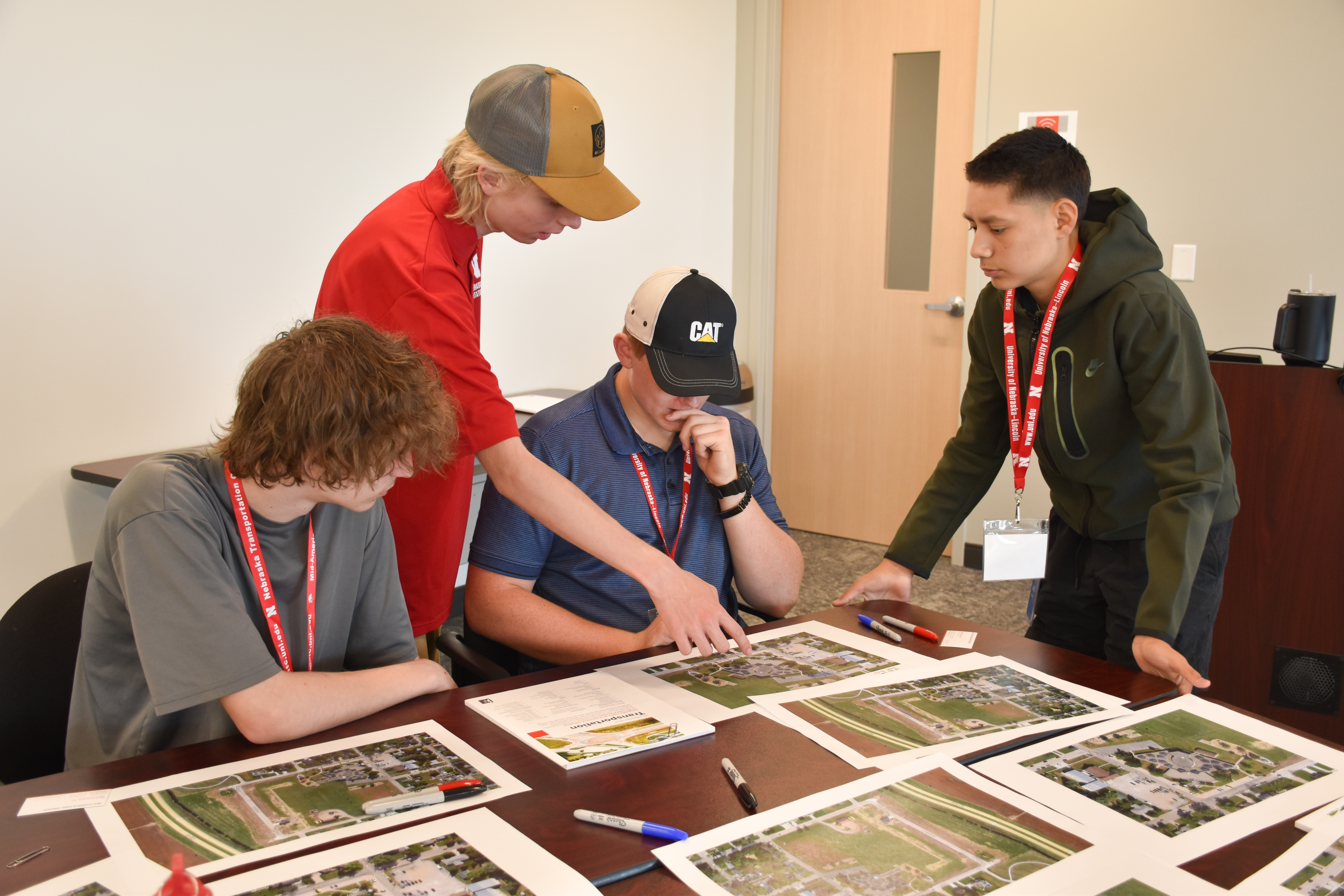 Students working at a table solving traffic flow problems at an elementary school.