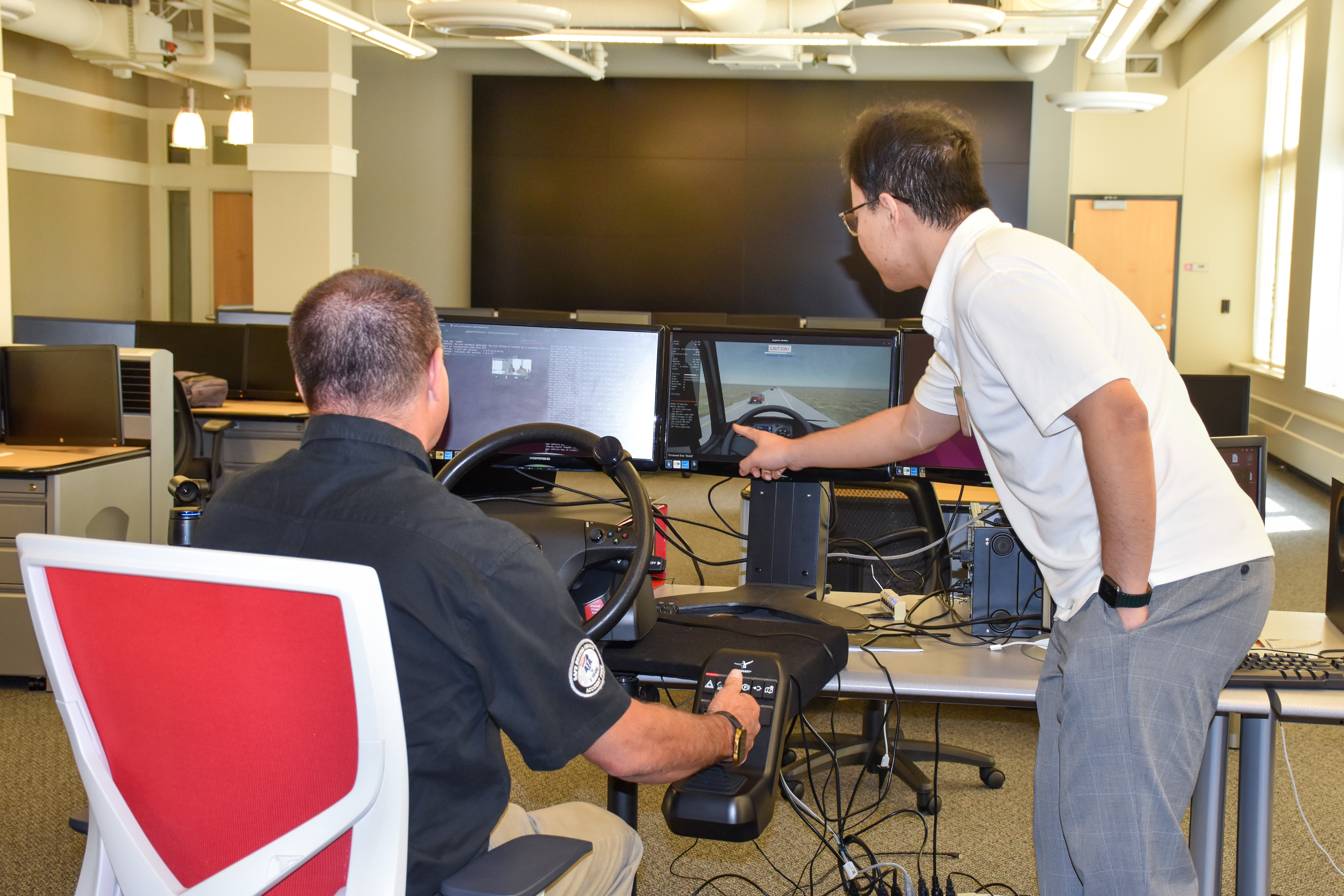 CMV driver testing the warning system on a simulator