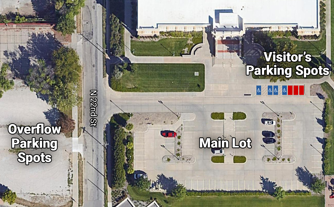 Sattelite map of the Whittier parking lot, showing the three visitors parking spots in the northeast corner next to four handicap accessible spots. The main lot is to the south of the building and the overflow parking to the west.