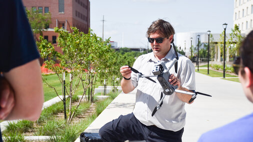 Dr. Richard Wood holding a drone.