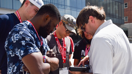 Dr. Richard Woods showing participants what the drone sees on a tablet.