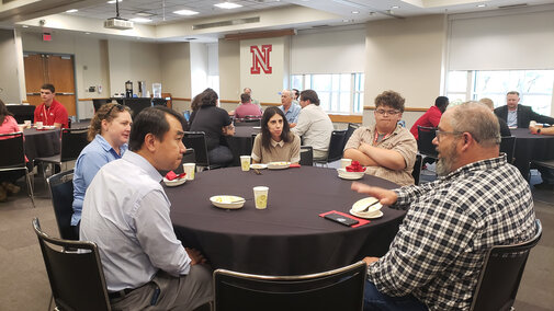 Table of partners and students at the Tracks to the Future networking dinner.