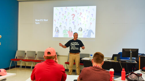 Richard giving a presentation in front of students