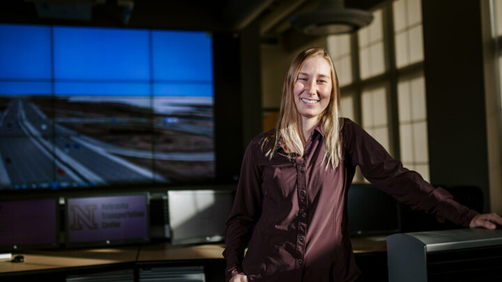 Sydney Allen posed in front of a screen