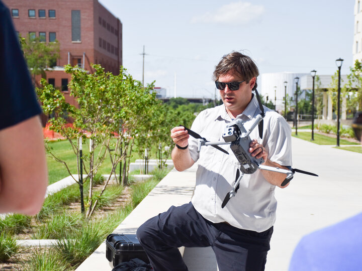 Dr. Richard Wood holding a drone.