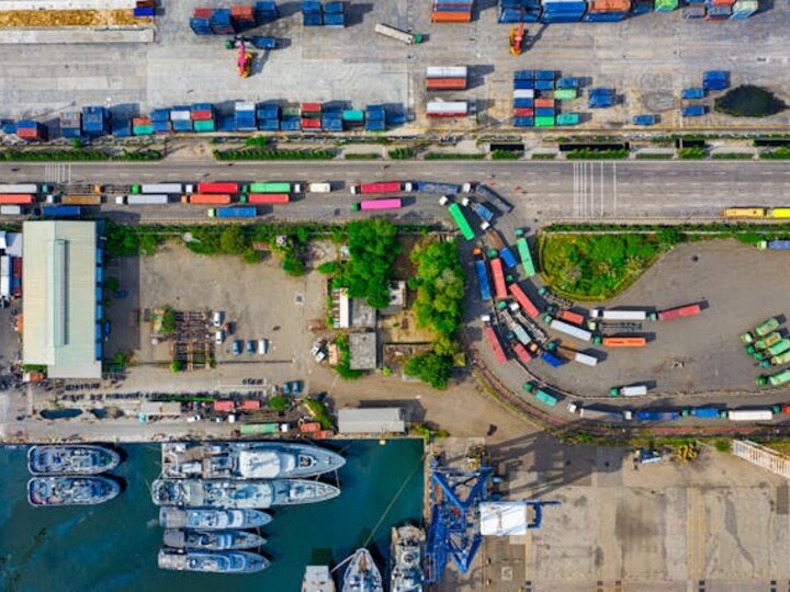 Aerial shot of trucks and cargo containers at bay