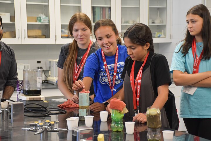 Students doing a water filtration experiment.
